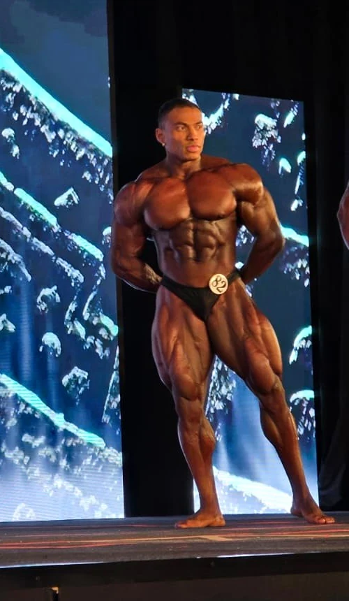 Athlete on stage in front of the stage screens
